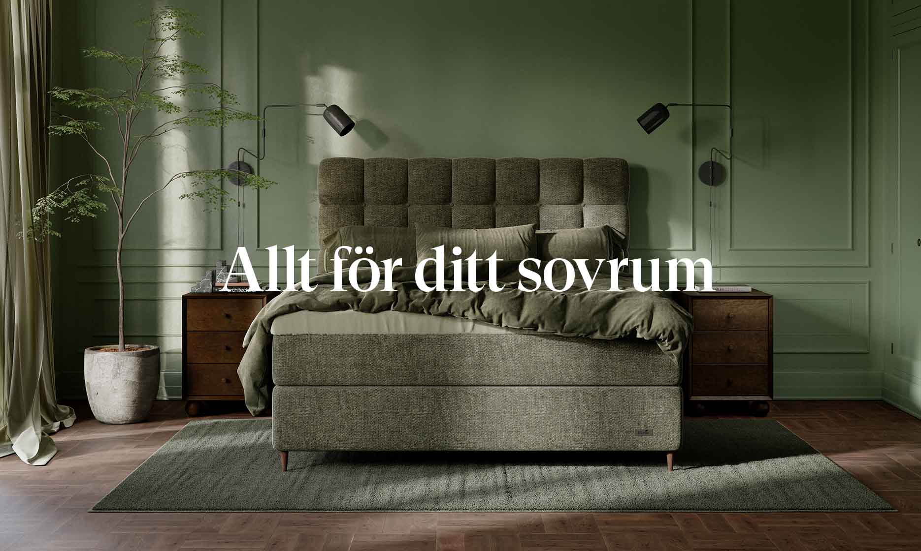 Inrett sovrum i dämpade gröna toner med en grön kontinentalsäng i fokus